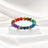 Armband mit Chakra-Steinen und silbernen Charms